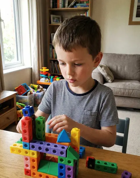 Homeschool engineering - child building with blocks